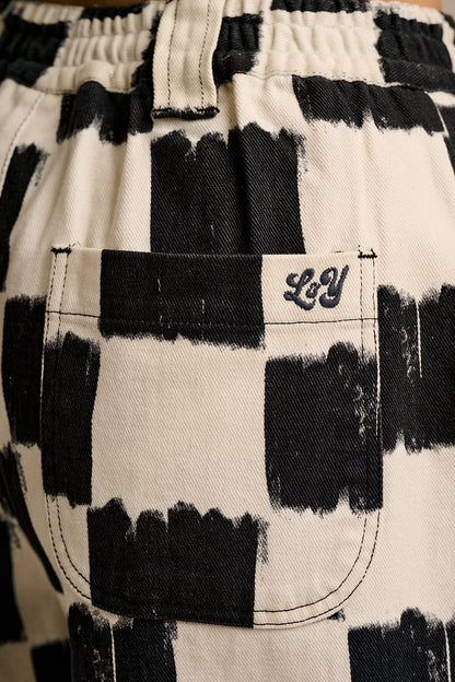 Ashby - Cotton Barrel Leg Trousers in Black & Ecru Blurred Checkerboard