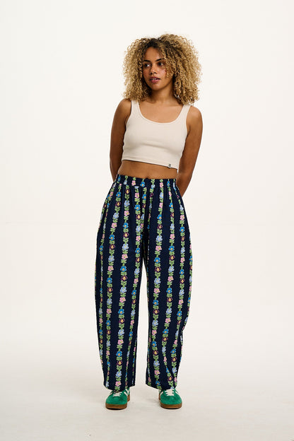 Freddie - Barrel Leg Cotton & Linen Trousers in Navy Island Bloom Print