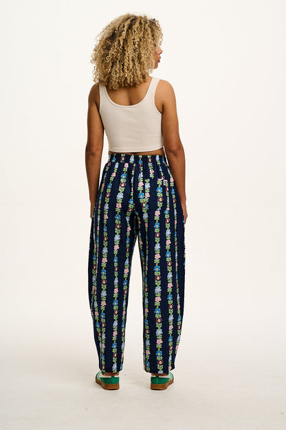 Freddie - Barrel Leg Cotton & Linen Trousers in Navy Island Bloom Print