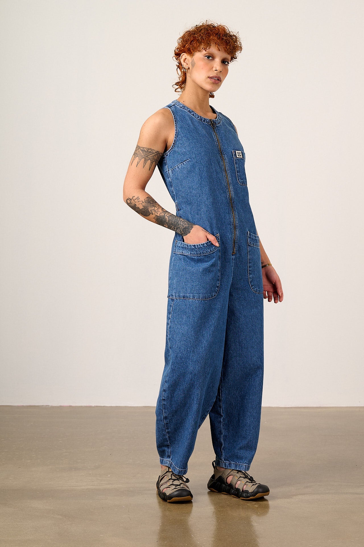Nari - Light Weight Denim Sleeveless Jumpsuit in Mid Wash