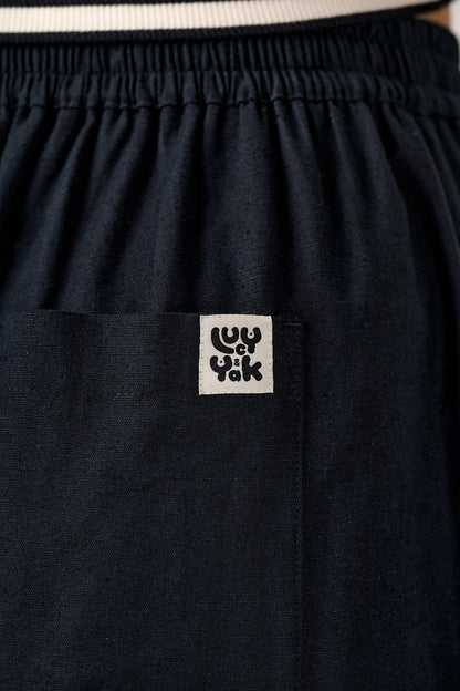 Renata - Cuffed Cotton Balloon Leg Trousers in Black